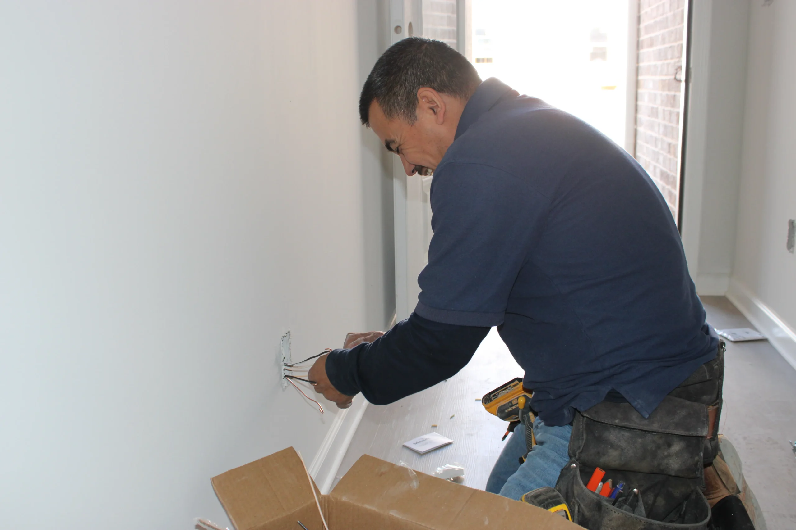 Electrician Installing Receptacle Electrician Installing Receptacle